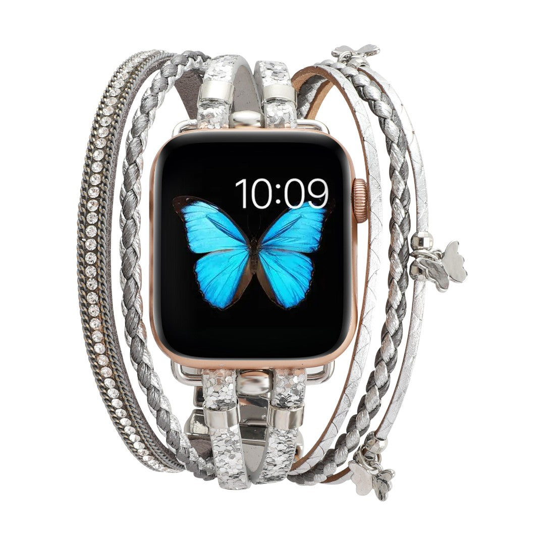 Bracelet pour Apple Watch en cuir argenté multi-rangs avec strass brillants et fermoir boucle papillon délicat.
