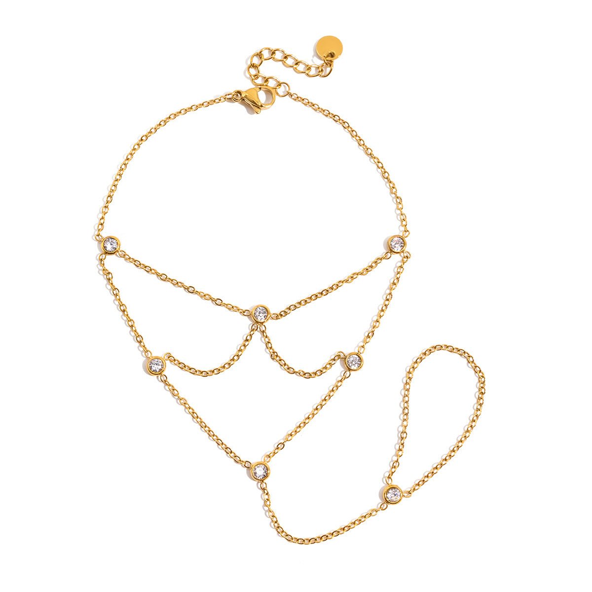 Bijou de main doré en acier inoxydable avec chaînes fines et pierres scintillantes, design élégant en soirée.