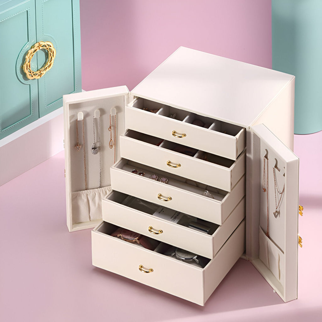 Boîte à bijoux nomade blanche avec tiroirs multiples et portes latérales dotées de rangements suspendus pour colliers et.