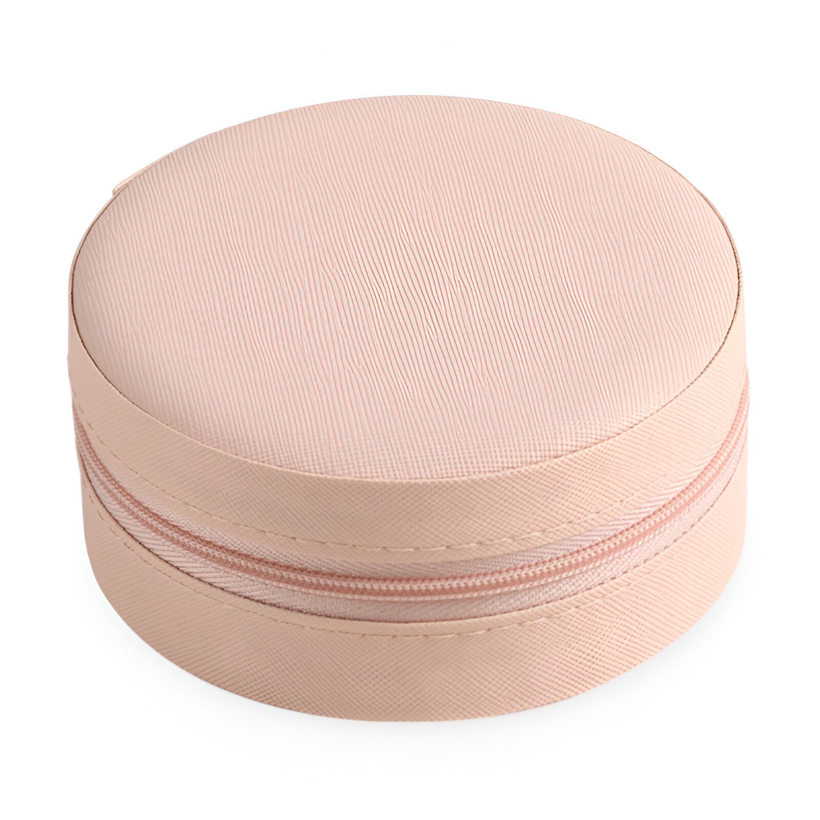 Boîte à bijoux nomade ronde rose avec fermeture éclair et texture lisse.