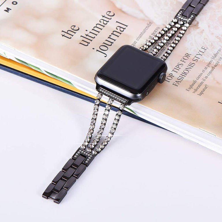 Bracelet Apple Watch noir avec cristaux scintillants, maillons métalliques fins, fermoir élégant.