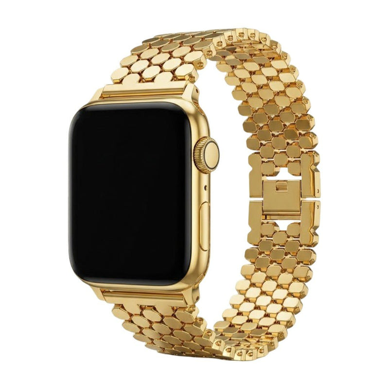 Bracelet Apple Watch femme en métal doré avec mailles alvéolées en forme de ruche et fermoir invisible luxueux.