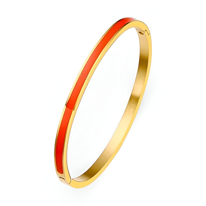 Bracelet jonc plaqué or avec émail orange vibrant en titane, style minimaliste pour femme.
