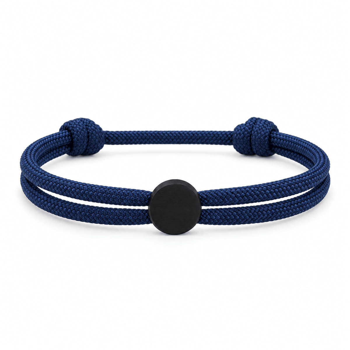 Bracelet Marsin Bleu marine et noir, cordon ajustable et pastille ronde, posé de face sur fond blanc
