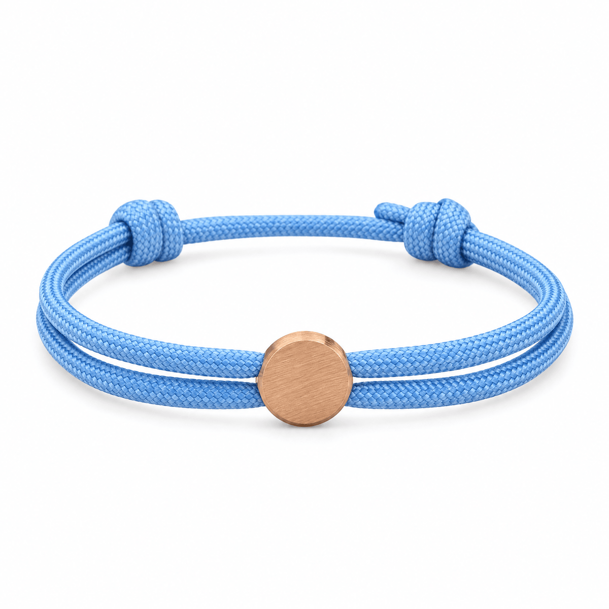 Bracelet Marsin Bleu clair et or rosé, cordon ajustable et pastille ronde, posé de face sur fond blanc