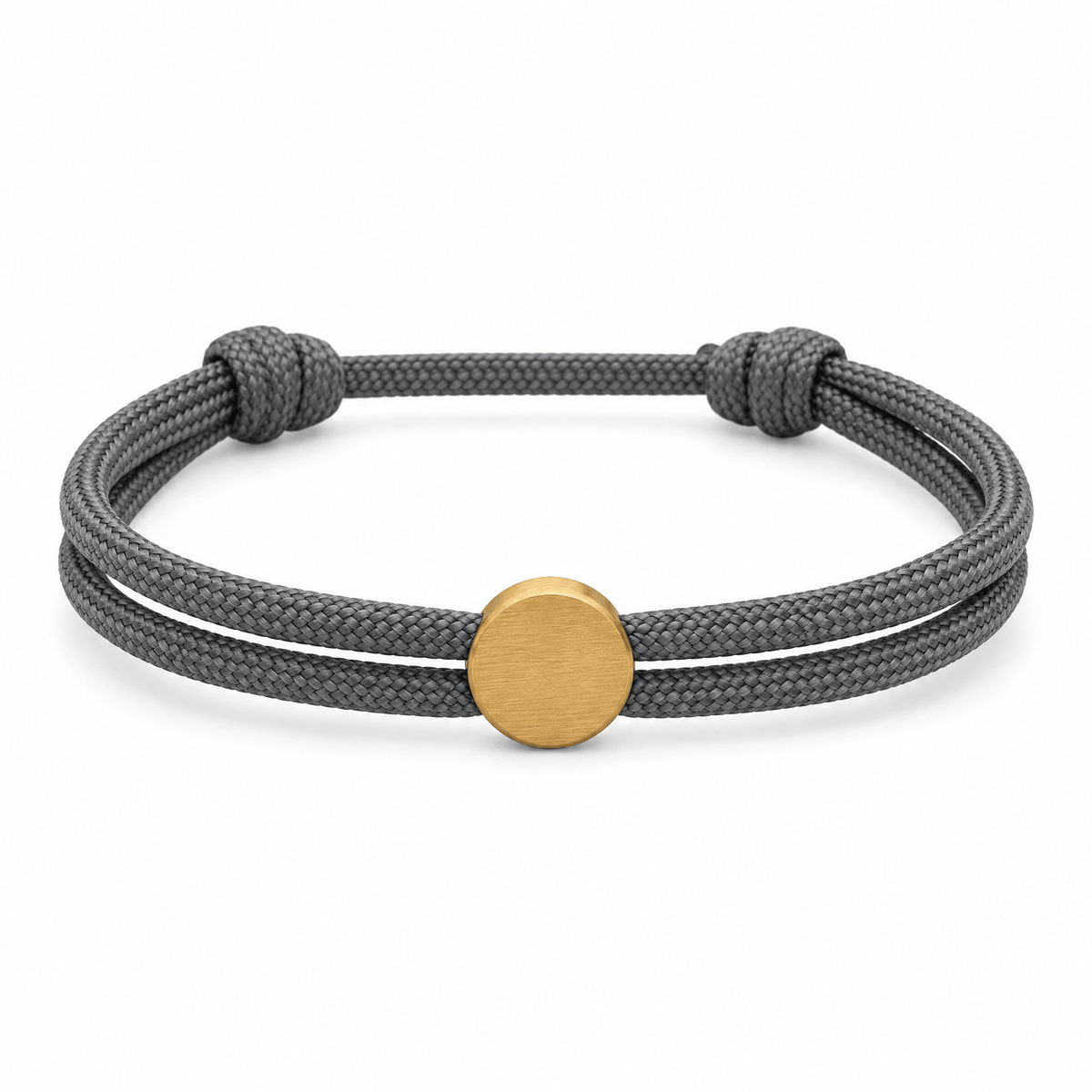 Bracelet Marsin Gris et or, cordon ajustable et pastille ronde, posé de face sur fond blanc