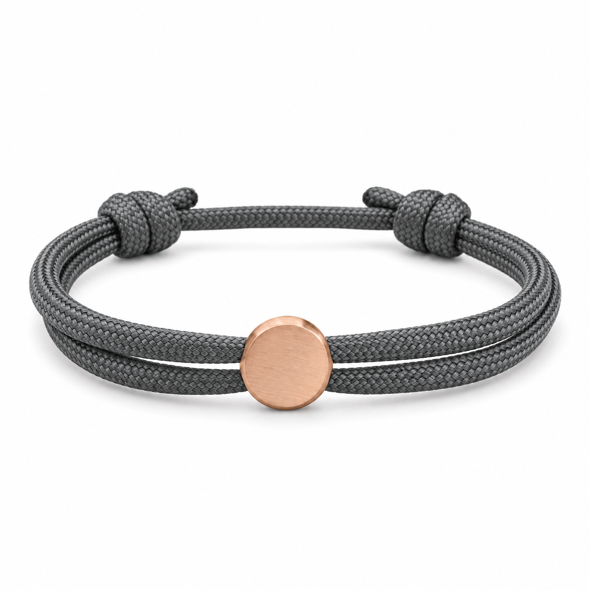 Bracelet Marsin Gris et or rosé, cordon ajustable et pastille ronde, posé de face sur fond blanc
