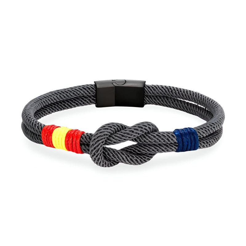 Bracelet cordon noir avec noeud central, drapeau espagnol tissé en rouge, jaune et bleu, fermoir magnétique noir mat.