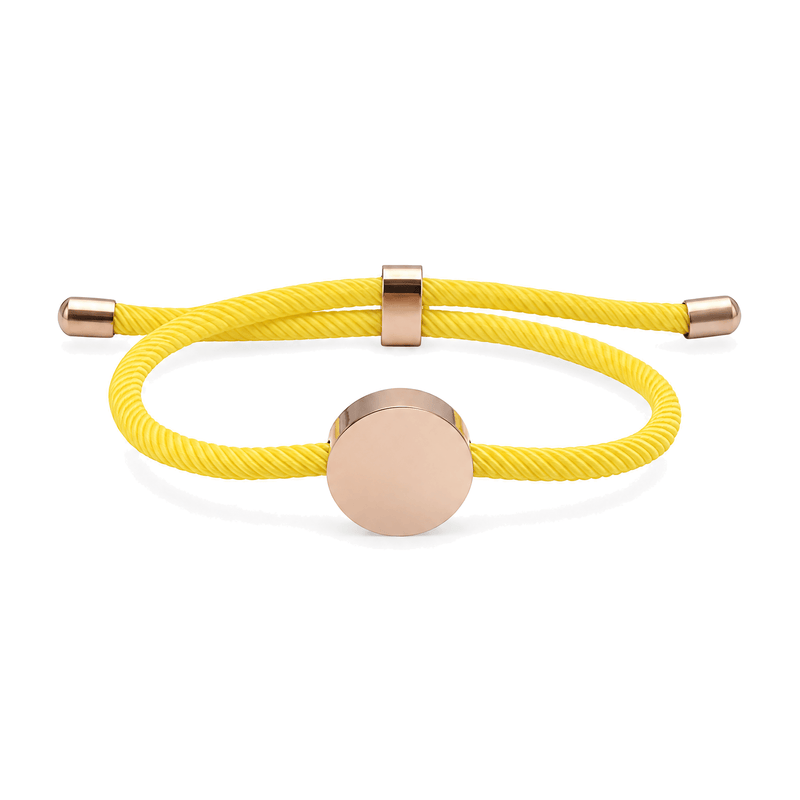 Bracelet Dax Or rosé / Jaune, cordon ajustable et médaillon rond, posé de face sur fond blanc