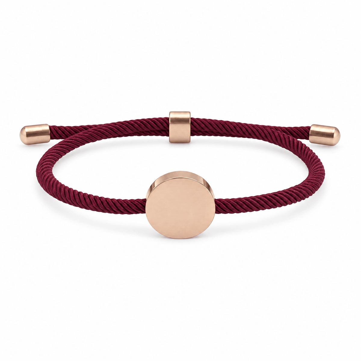 Bracelet Dax Or rosé / Bordeaux, cordon ajustable et médaillon rond, posé de face sur fond blanc