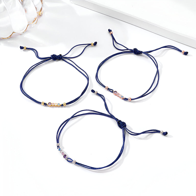 Lot de trois bracelets cordon bleu marine avec perles en argent sterling et zircons colorés modèles Mélodie.