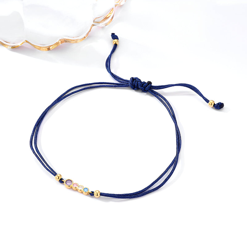 Bracelet cordon bleu marine avec pendentif en argent sterling orné de zircons colorés raffinés.