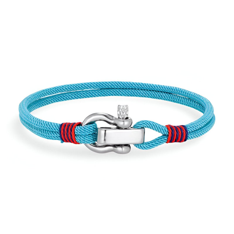 Bracelet cordon turquoise avec manille en acier inoxydable et détails rouges sur le fermoir.