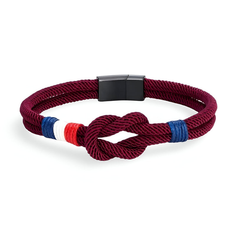 Bracelet cordon bordeaux avec noeud et détails tricolores bleu blanc rouge, fermoir noir mat.