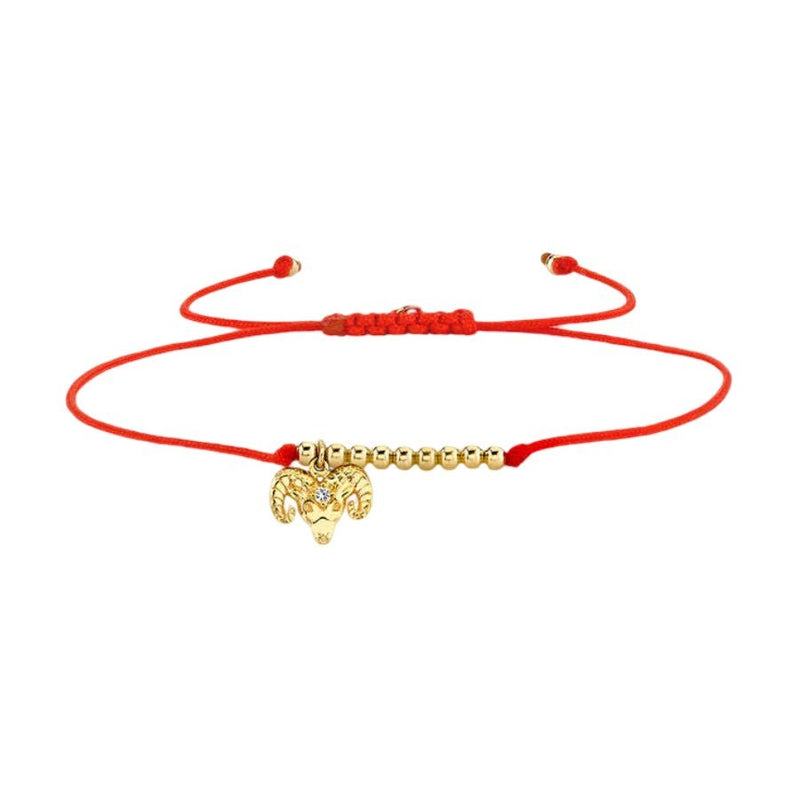 Bracelet cordon rouge avec perles dorées et pendentif signe du zodiaque Bélier.