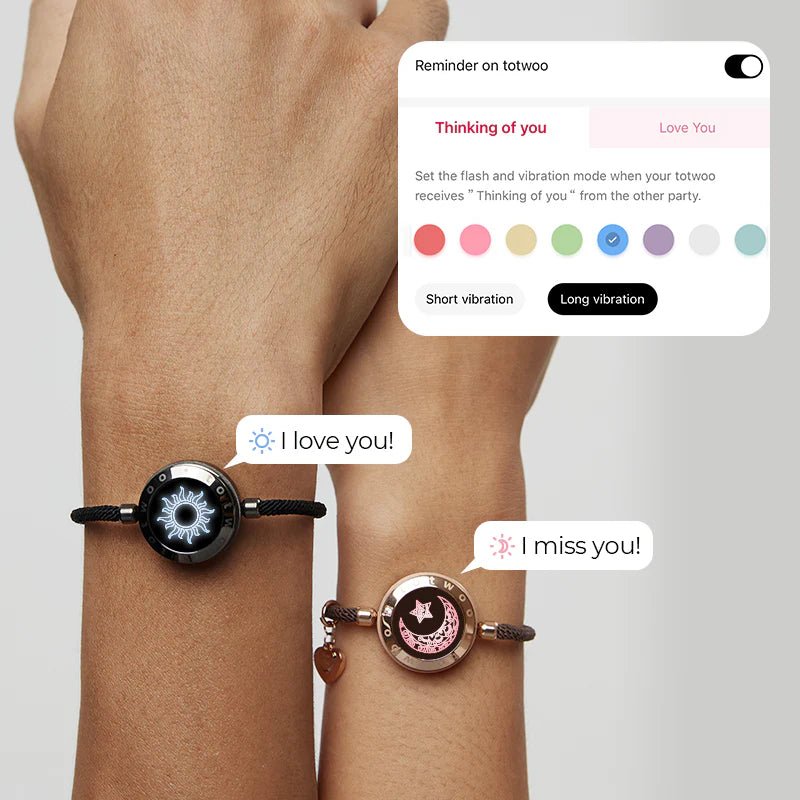 Bracelet couple Nayel noir avec design soleil blanc et lune rose, cordon coulissant ajustable en tissu.
