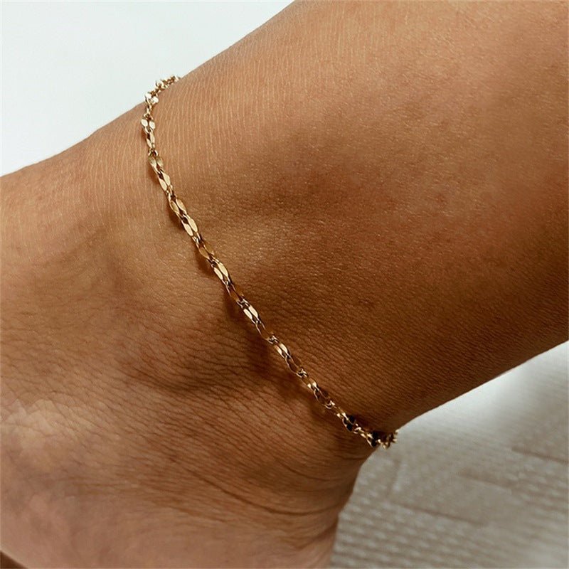 Bracelet de cheville Sémina en acier inoxydable or rosé, maille grain de café délicate.