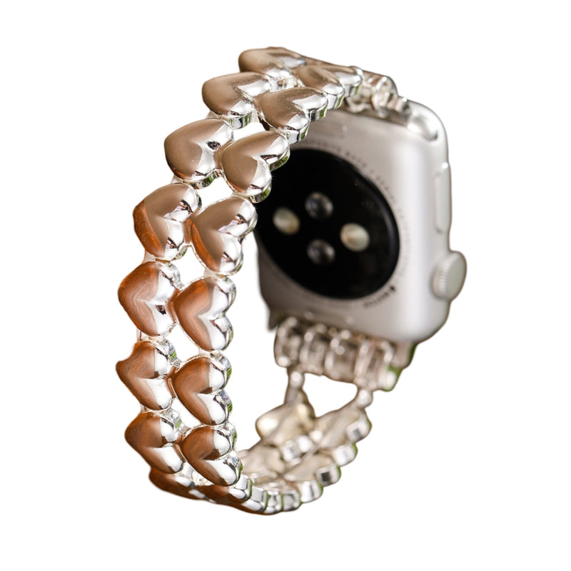 Bracelet de montre Apple en métal argenté, motif cœurs en chaîne élégante, pour femmes.