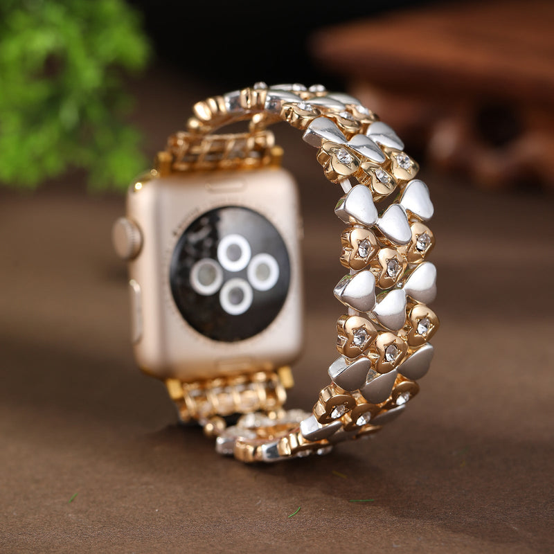 Bracelet Apple Watch or rosé avec motif cœurs blancs, élégant et féminin, modèle Jimena, taille 38-42 mm.