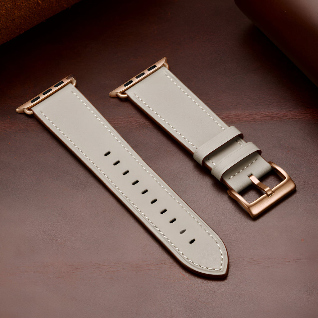 Bracelet Apple Watch en cuir blanc avec boucle métallique couleur or rose, modèle Jano.
