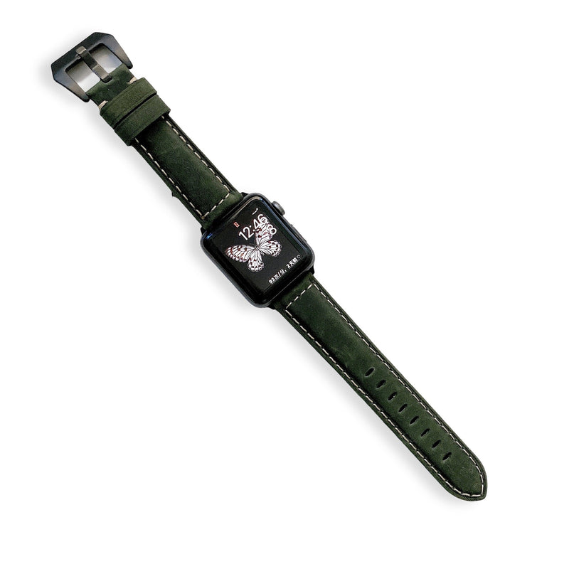 Bracelet Apple Watch en cuir vert foncé avec coutures blanches et boucle argentée, pour femme.