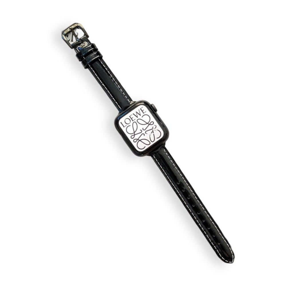 Bracelet Apple Watch cuir noir pour femme, modèle Dexa, boucle argentée élégante.