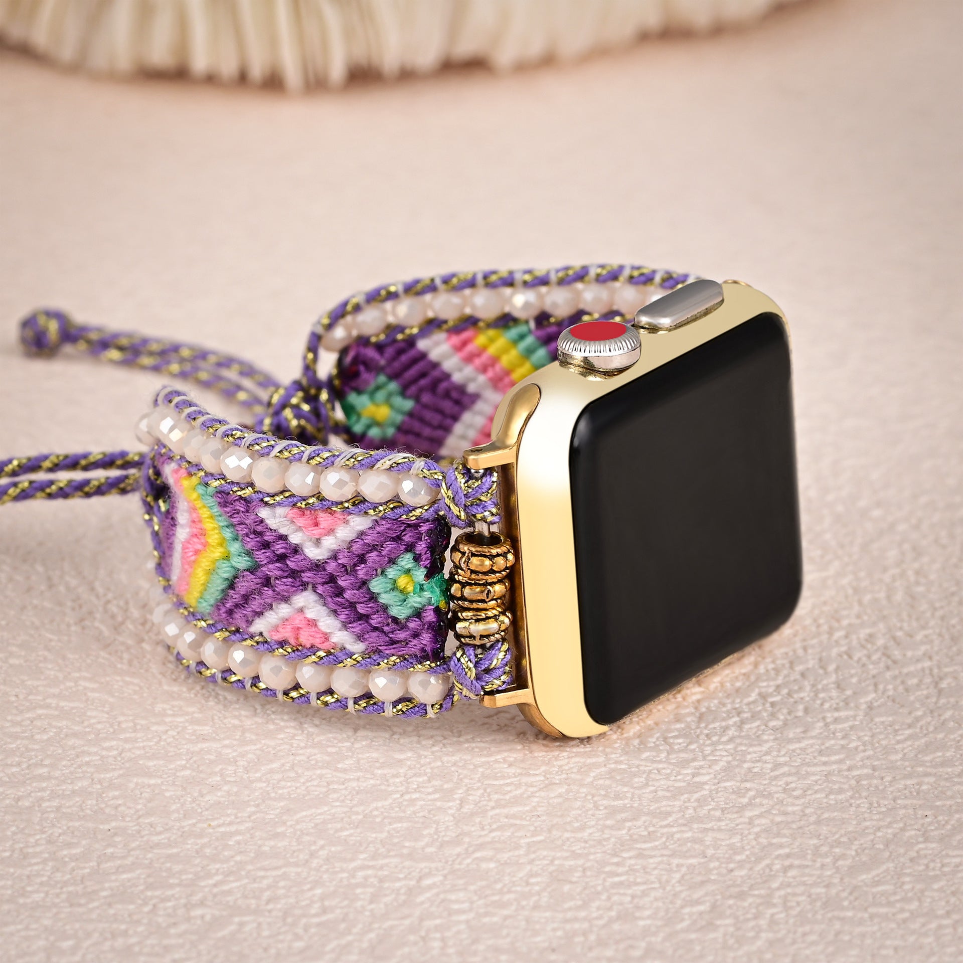 Bracelet Apple Watch violet en nylon tressé avec détails en cristal et fermoir doré, modèle Jaxel.