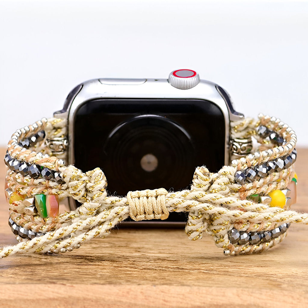 Bracelet Apple Watch femme Lir en nylon doré tressé avec cristaux multicolores et nœud ajustable.
