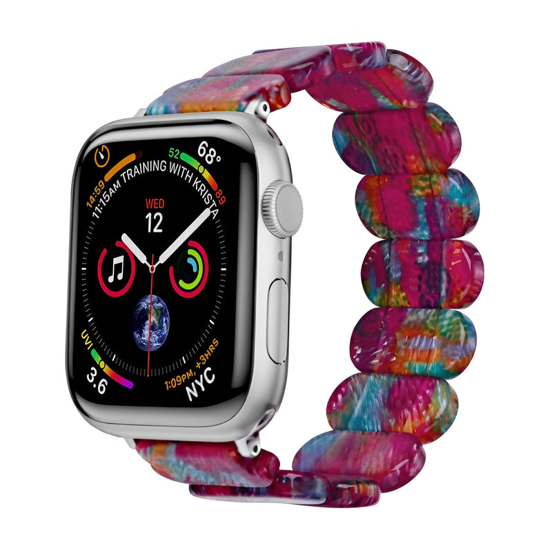 Bracelet Apple Watch en résine multicolore effet marbré rose, violet, bleu et jaune.
