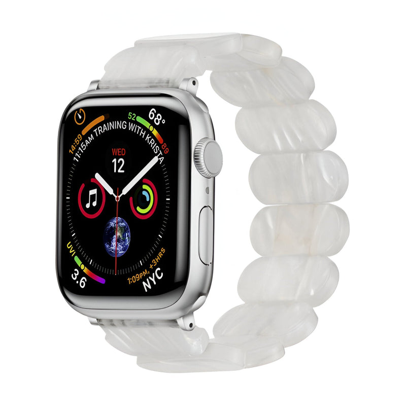 Bracelet Apple Watch pour femme en résine blanche tachetée avec maillons ovales translucides.