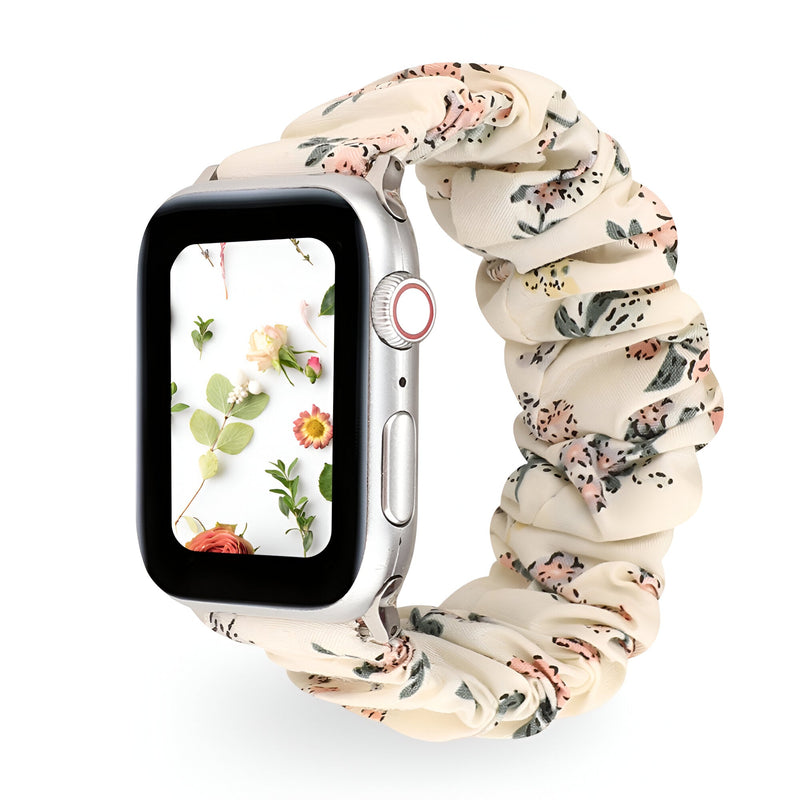Bracelet Apple Watch élastique floral beige avec petites fleurs rouges et vertes, style Leyra.