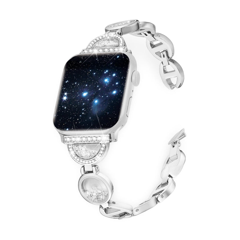 Bracelet argenté pour Apple Watch avec incrustations de sable et chaîne élégante.