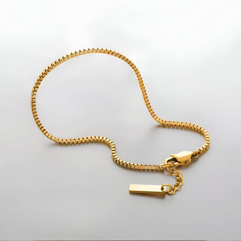 Bracelet homme en acier inoxydable doré avec maillons carrés et fermoir plaqué or, modèle Emilio.