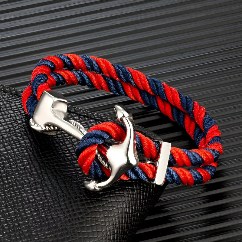 Bracelet double cordon rouge et bleu avec motif ancre argentée en acier inoxydable.