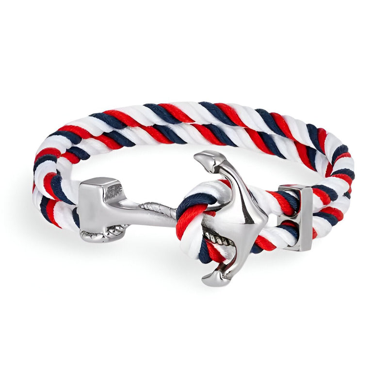 Bracelet double cordon rouge, blanc et bleu avec motif ancre argentée brillante.