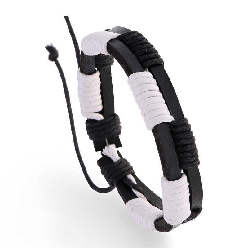 Bracelet double en cuir noir et blanc avec détails cirés et fermeture ajustable.