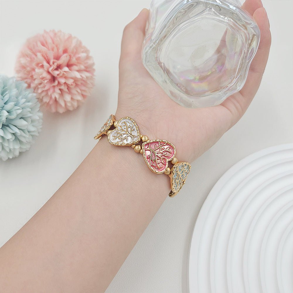Bracelet Apple Watch elastique, maillons coeur emailles motif arbre de vie, modele Cabra