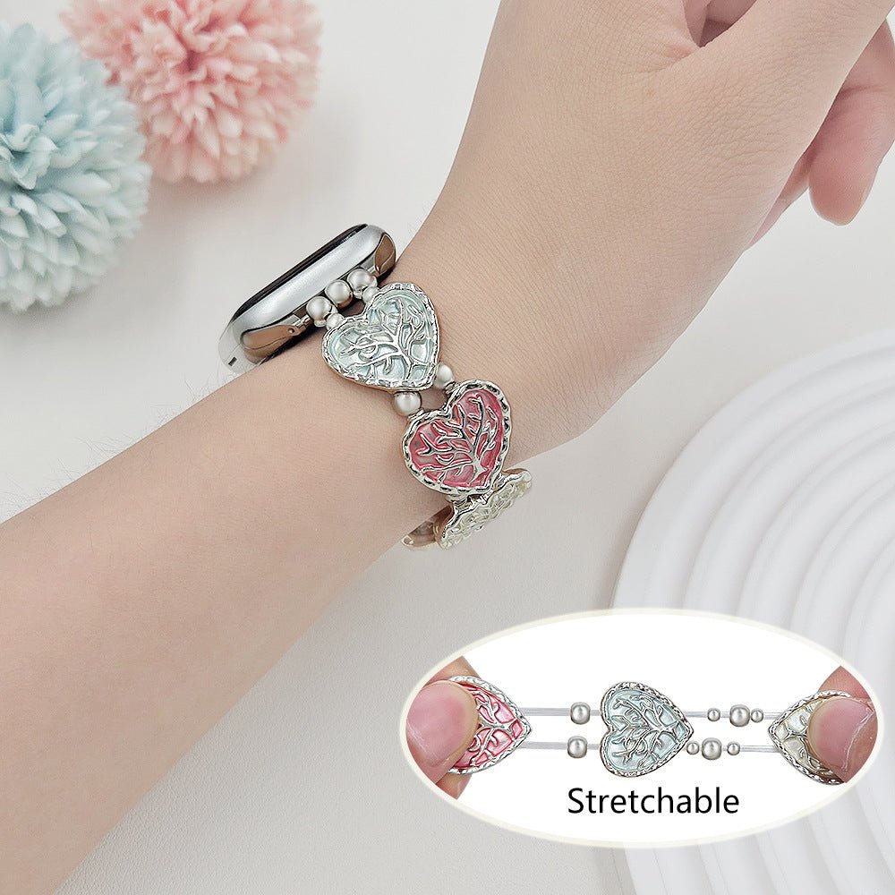 Bracelet Apple Watch elastique, maillons coeur emailles motif arbre de vie, modele Cabra
