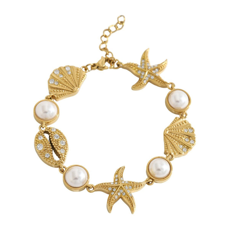 Pulsera de acero inoxidable dorado, perlas de agua dulce y dijes marinos, ajustable, modelo Ridèle