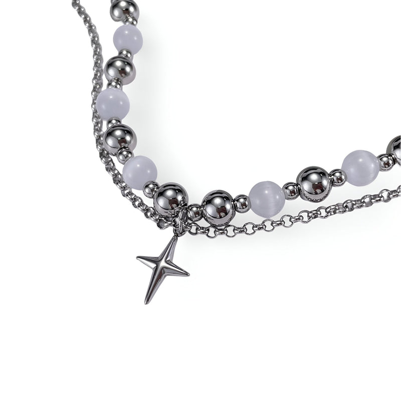 Bracelet homme en acier inoxydable argenté avec perles œil de chat et pendentif croix moderne.