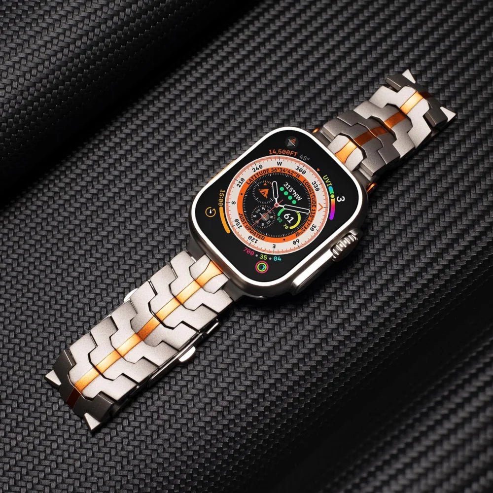 Bracelet pour Apple Watch en acier inoxydable gris avec touches orange, design ajustable haute technologie.