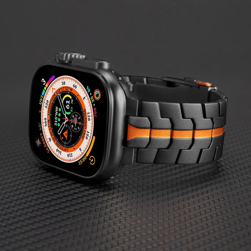 Bracelet en acier inoxydable noir avec bande orange, pour Apple Watch, style robuste et ajustable.