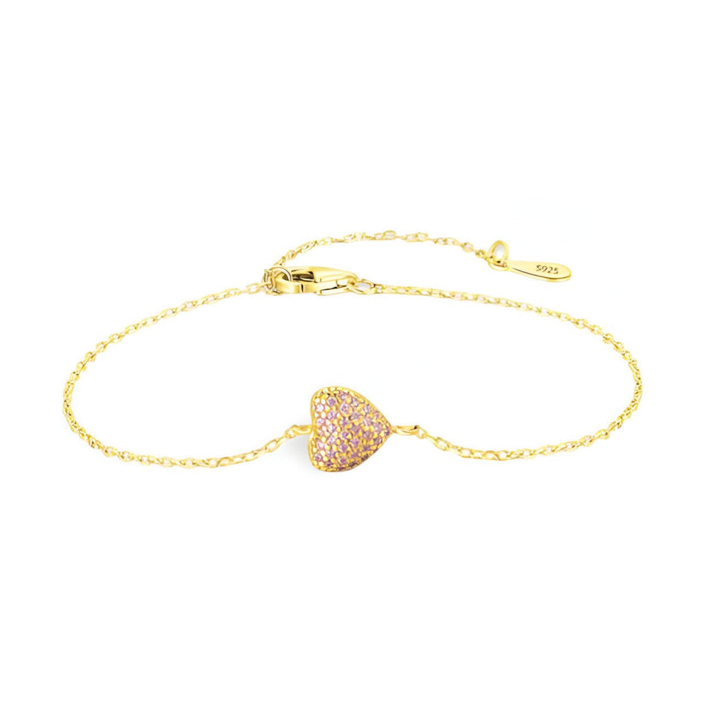 Bracelet fin en or avec cœur pavé de petits zircons, fermoir à mousqueton ajustable.