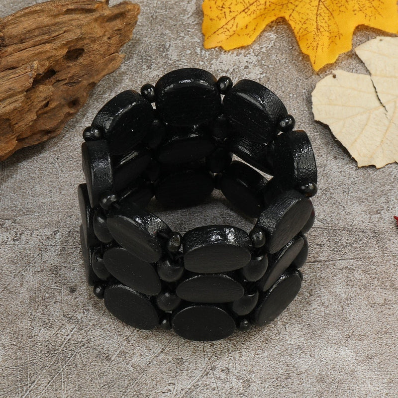 Bracelet femme en bois noir mat, maillons ovales larges, style original et naturel.