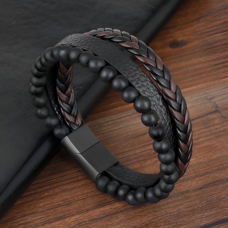 Bracelet homme en cuir noir et marron tressé avec perles volcaniques mates et fermoir métallique noir mat.