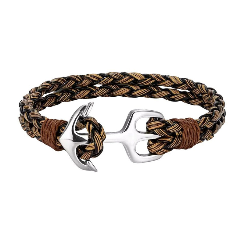 Bracelet en cuir tressé marron et beige avec ancre argentée en acier inoxydable, style marin.