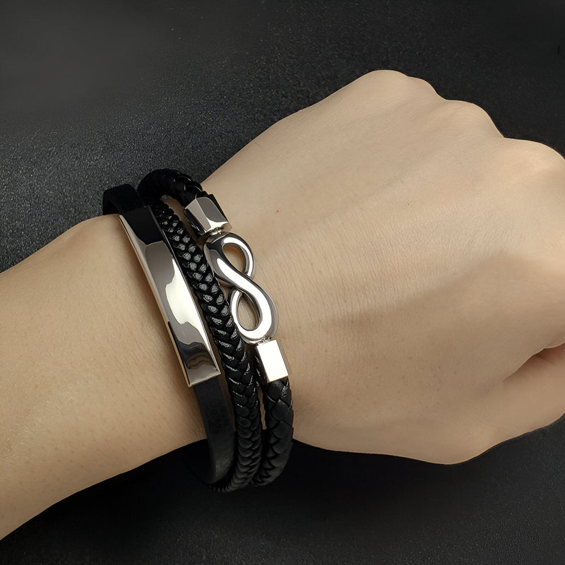 Bracelet multi-rangs noir en microfibre avec motif infini argenté et détails métalliques, modèle Garo.