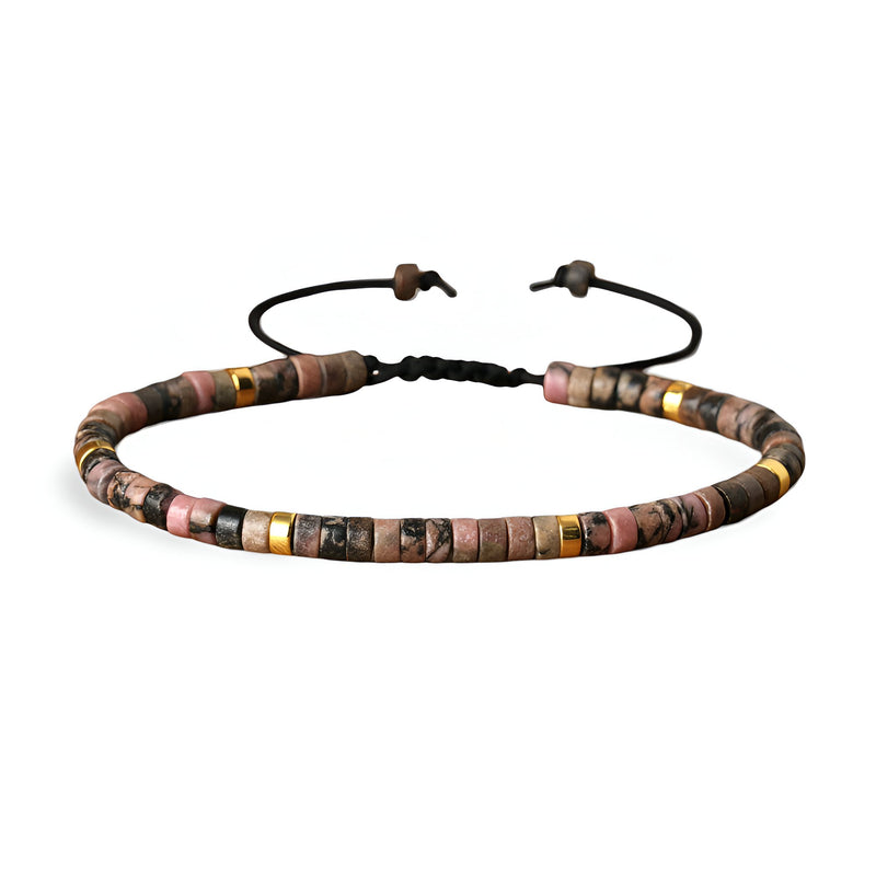 Bracelet mixte en perles heishi rhodonite rose tachetée avec lien ajustable noir.