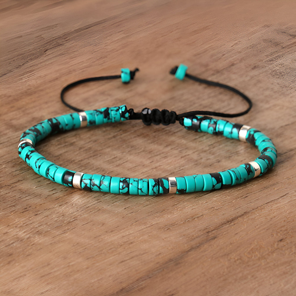 Bracelet mixte en perles heishi turquoise tacheté avec cordon noir ajustable.