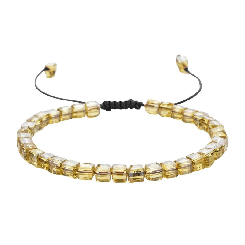 Bracelet ajustable à cordon noir et perles en cristal autrichien transparent doré.